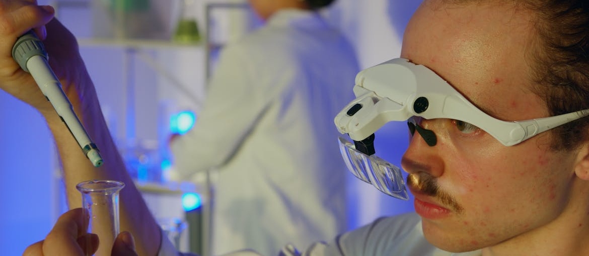 Man in a laboratory doing an experiment.