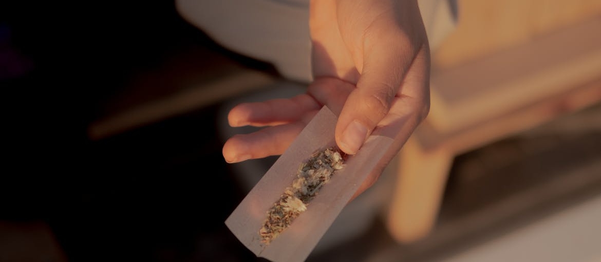 Person holding marijuana.