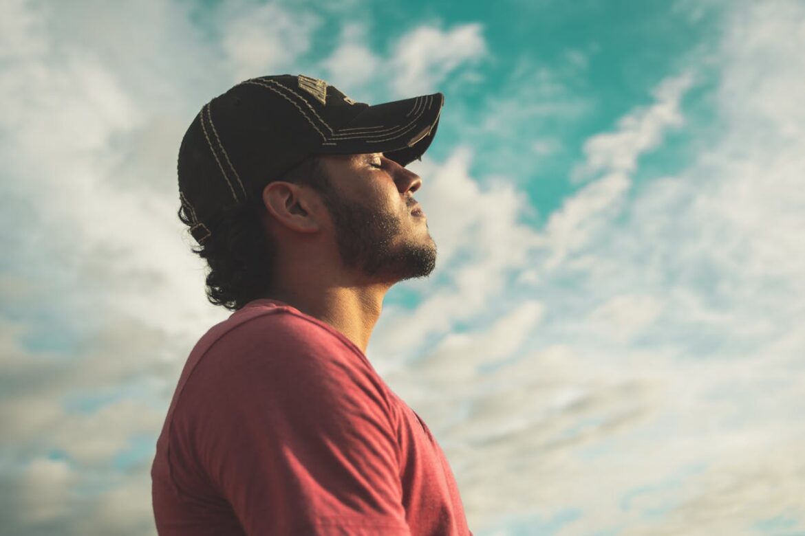 Man breathing and using calming techniques.
