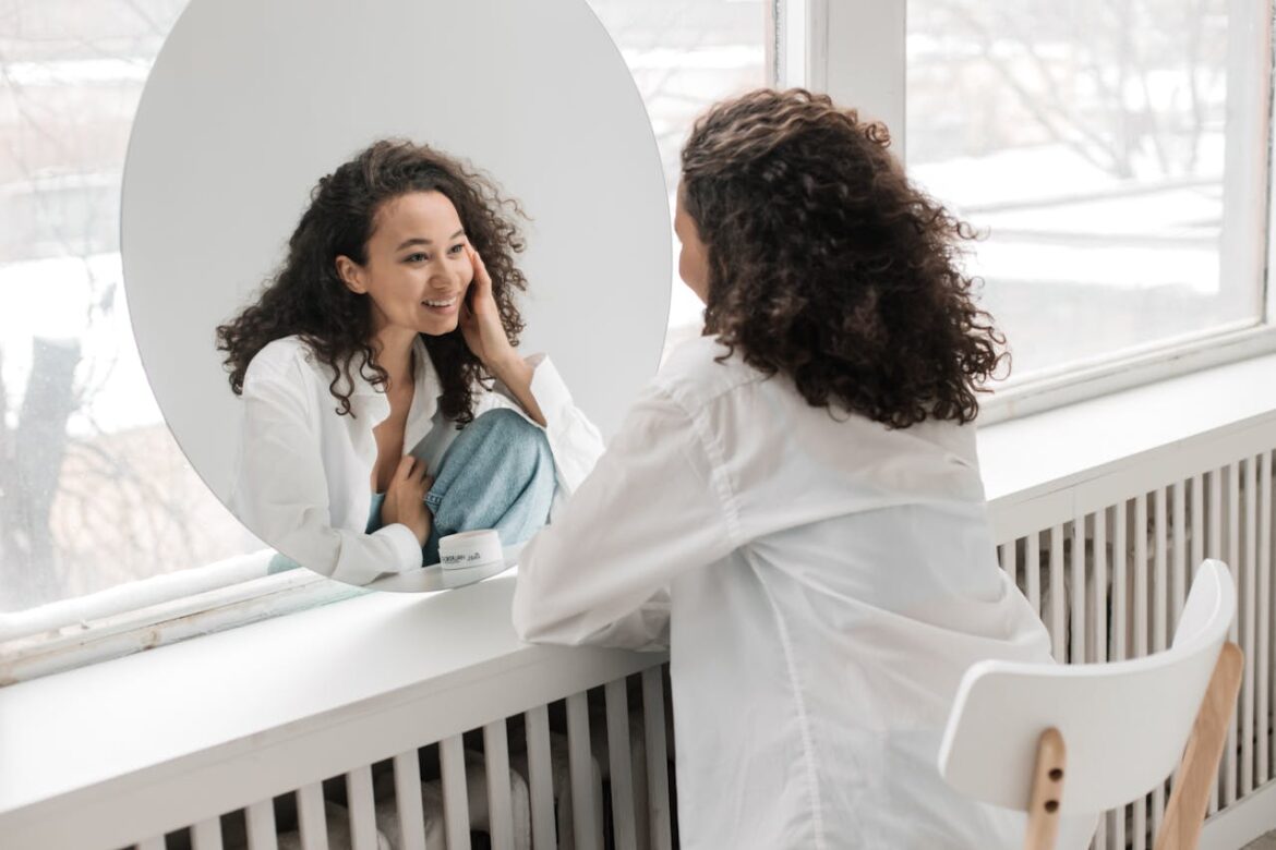 Woman looking at herself and practicing self forgiveness in recovery.
