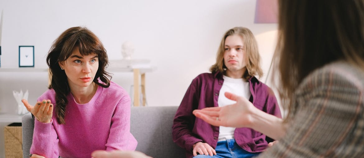 Couple talking to a therapist in couple therapy.