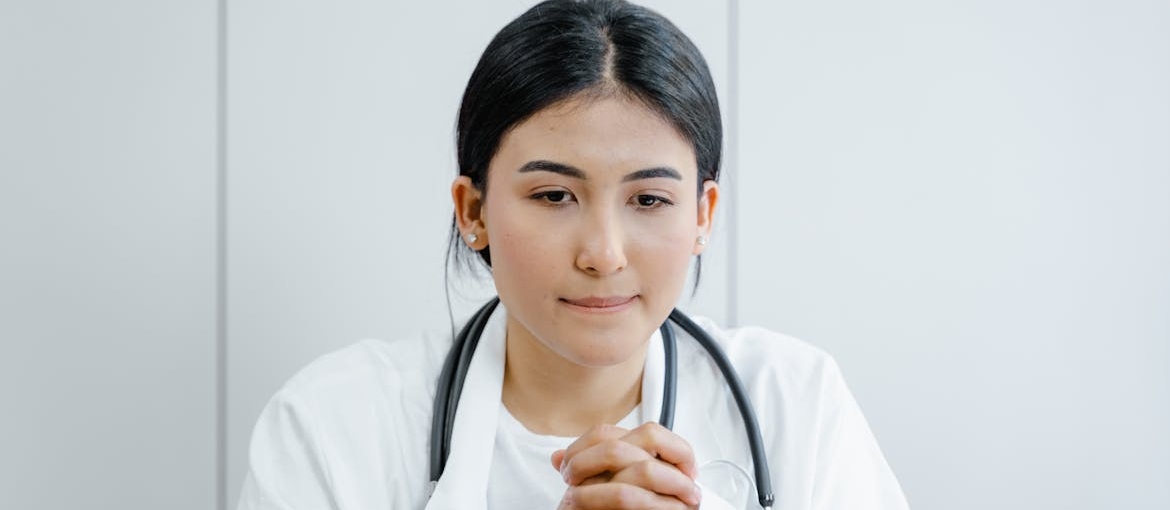 Doctor listening to a patient.