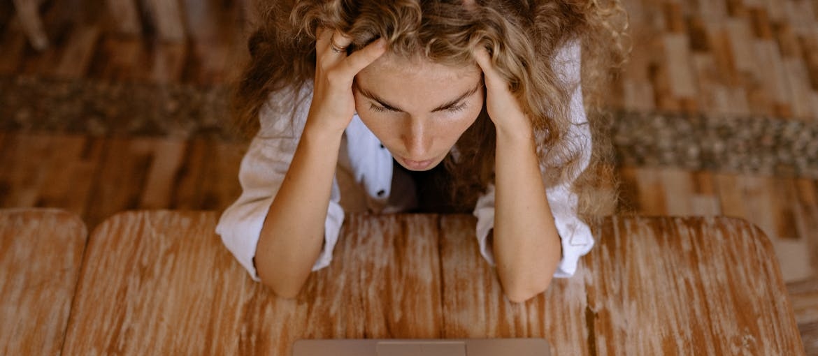 Stressed out woman experiencing a personality change when drinking alcohol.