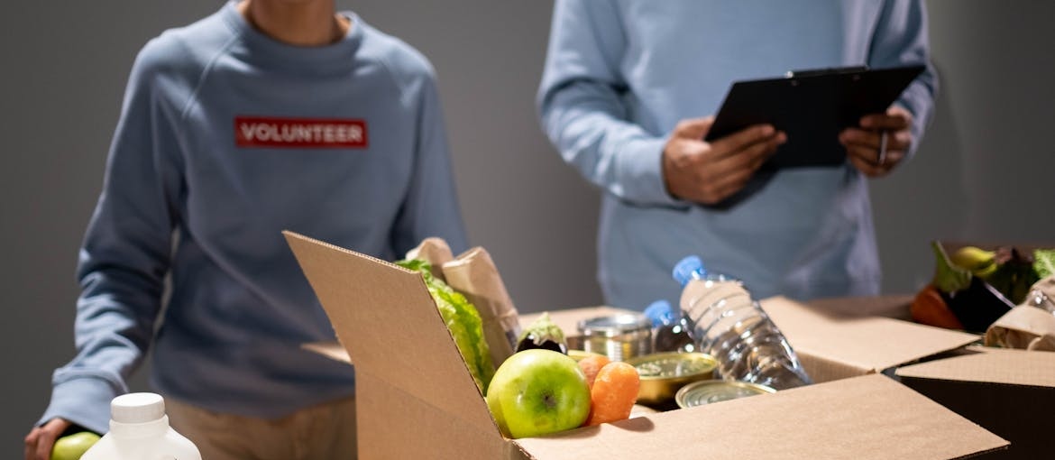 People volunteering in a food bank.