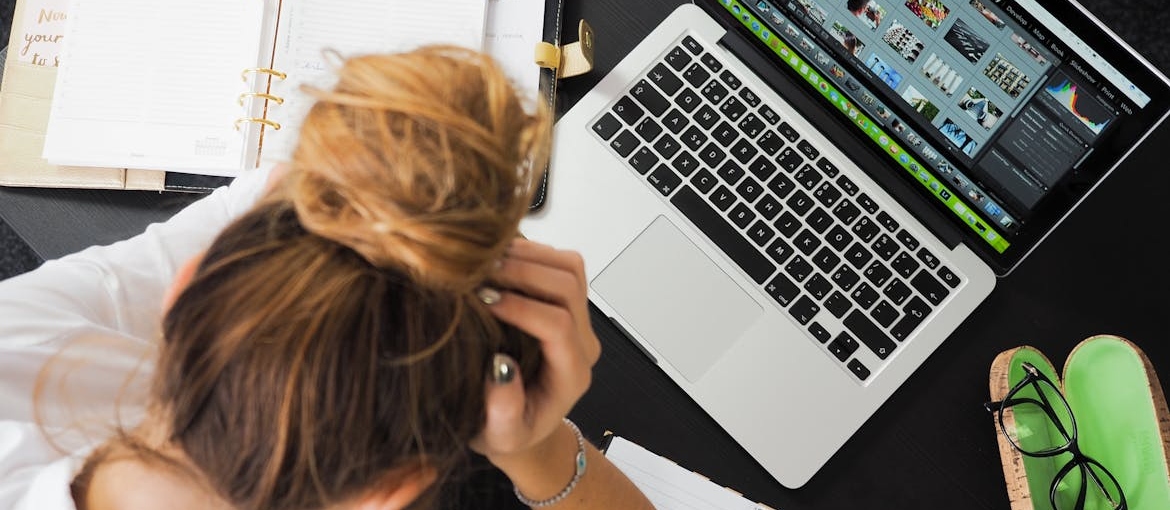 Woman having trouble focusing at work.
