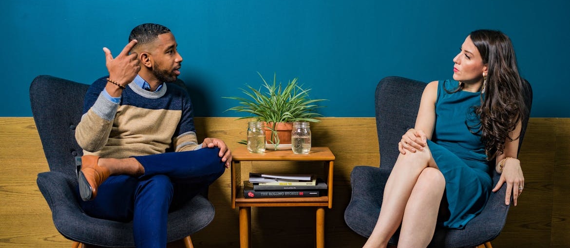 Two people discussing financial responsibility.