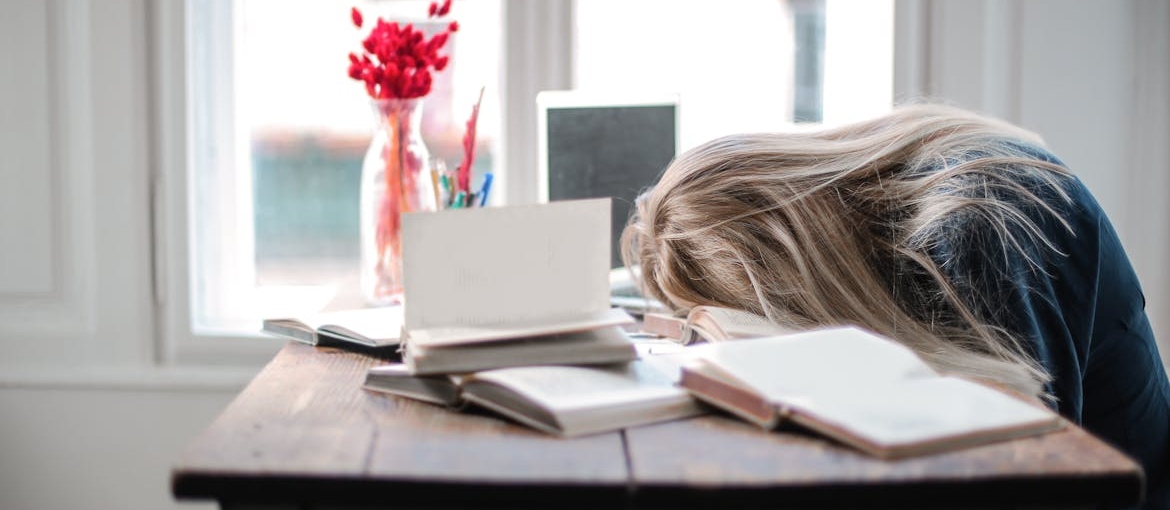 Young girl struggling with studying.