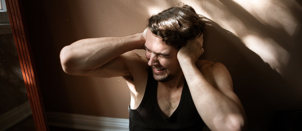 Man experiencing PTSD symptoms.