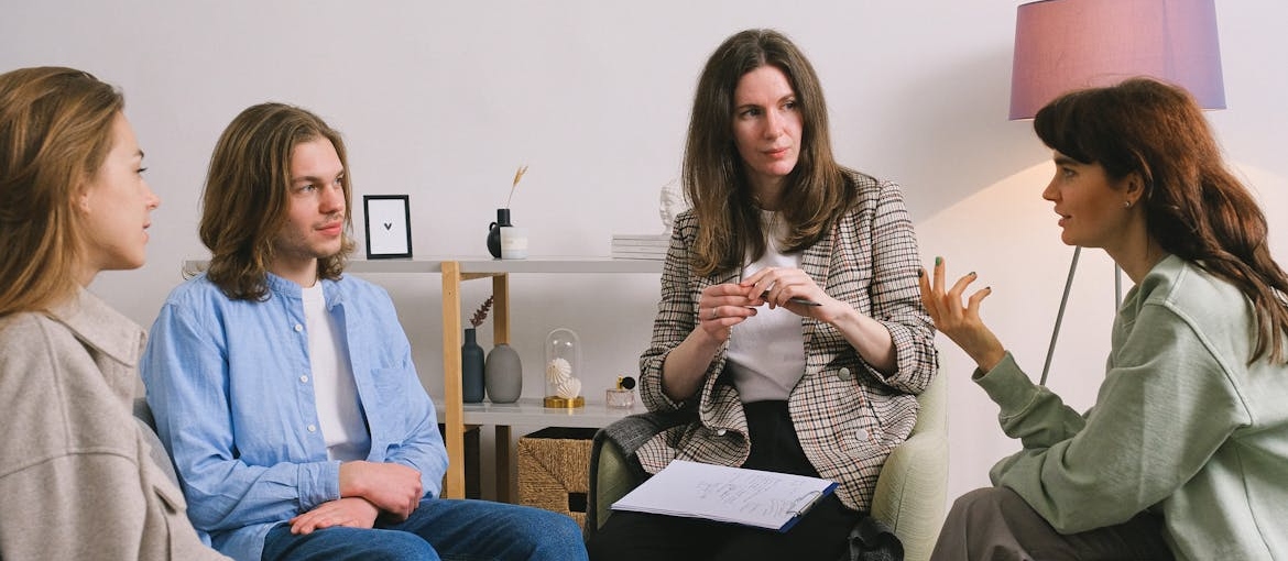 People talking about being in a relationship with an addict in recovery in a support group.
