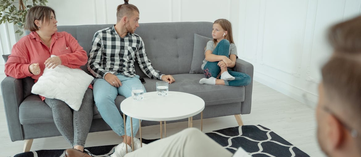 Family in therapy helping a child whose parent is struggling with addiction.