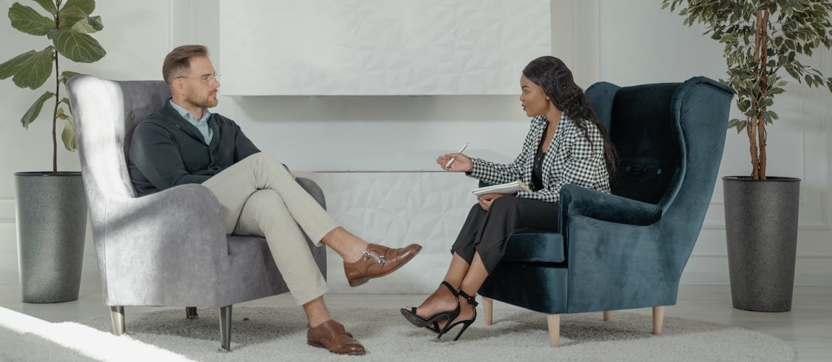 Man talking with his therapist about his issues.