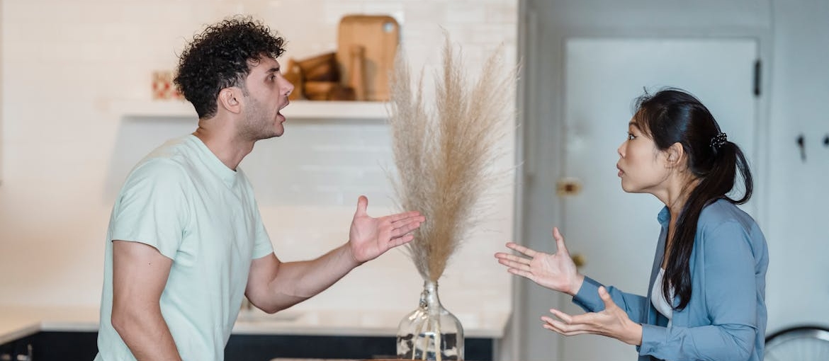 Couple having an argument in the living room.