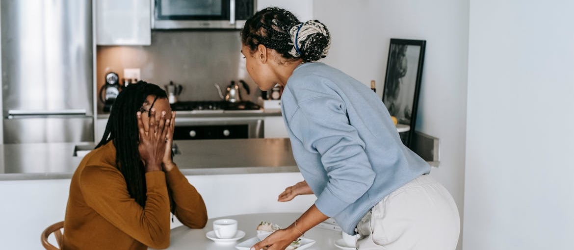 Couple having an argument in their kitchen.