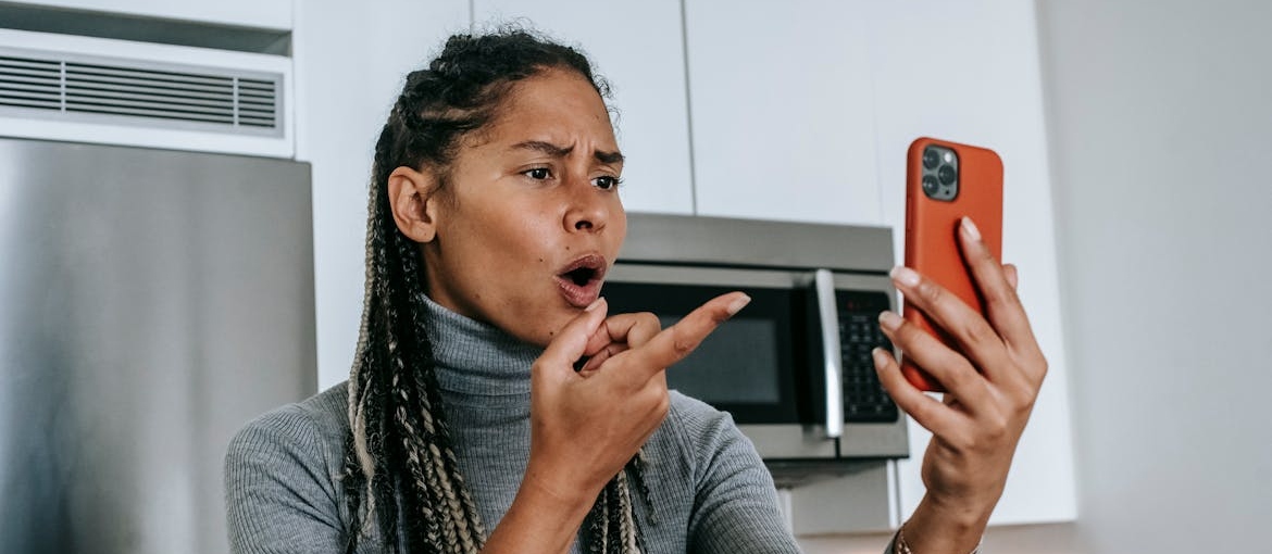 Angry woman yelling at her phone.