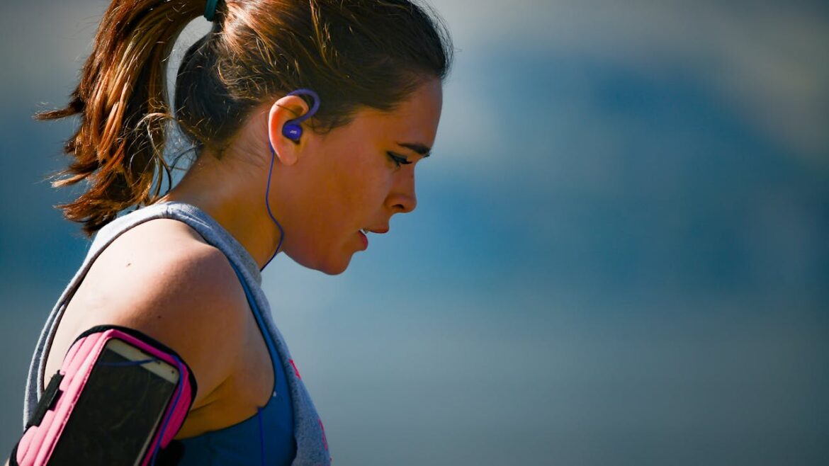 Woman doing breathing exercises while running.