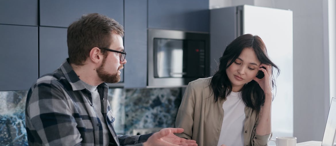 Man having a serious conversation with an alcoholic loved one.