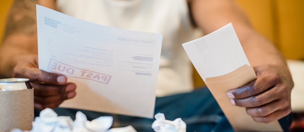 Man looking at his unpaid bills.