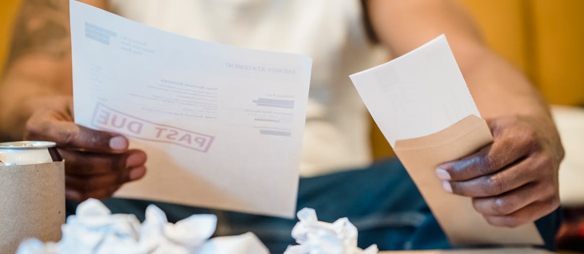 Man looking at his unpaid bills.