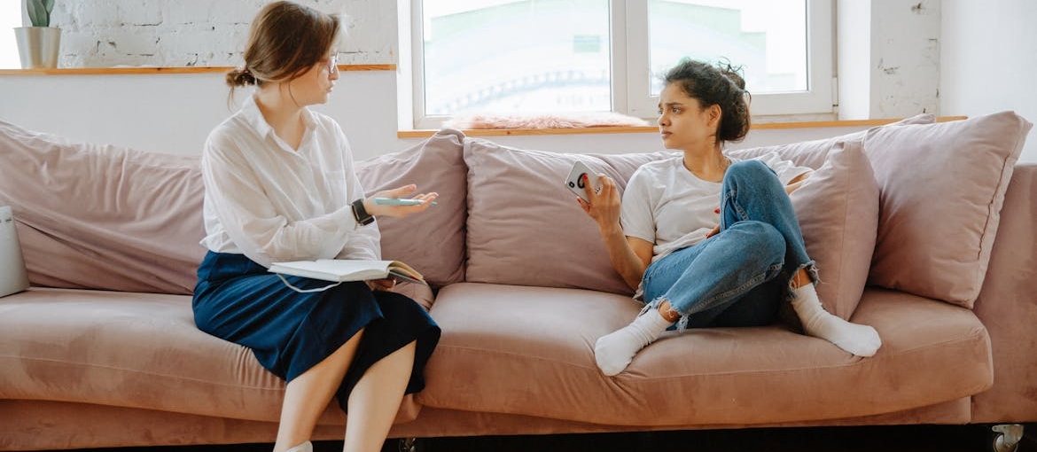 Woman talking with her therapist about her mental health concerns.