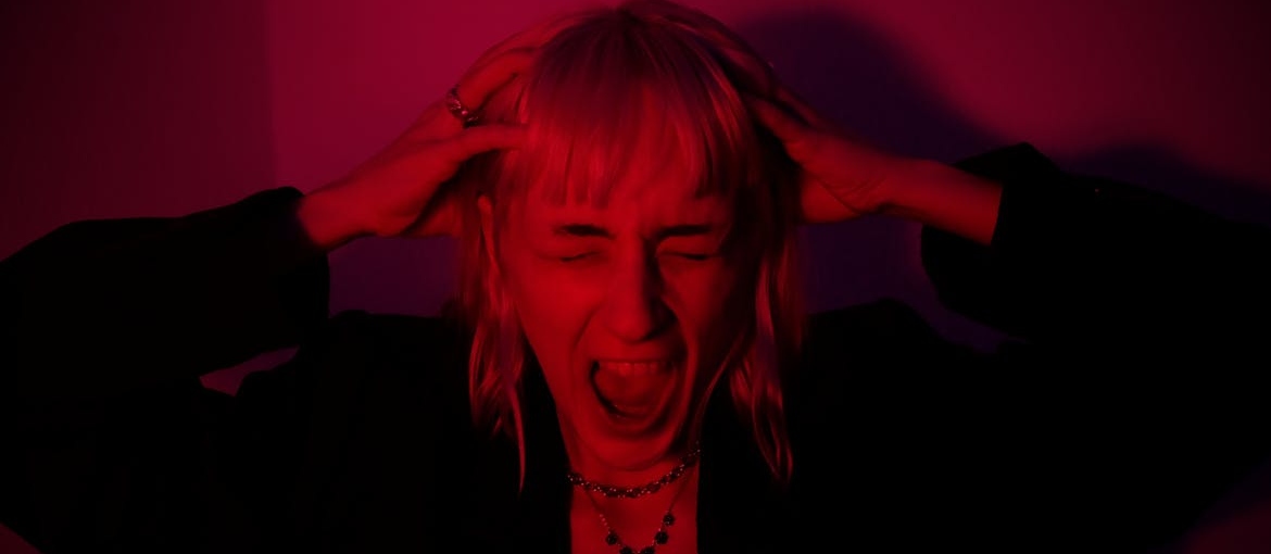 Woman screaming while worrying about how long does weed paranoia last.