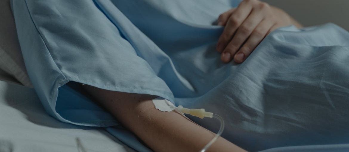 Woman getting an IV.