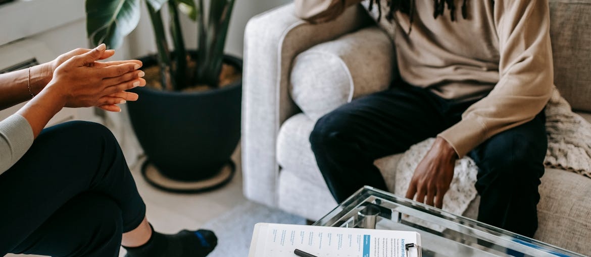 Therapist explaining therapy to a new client.