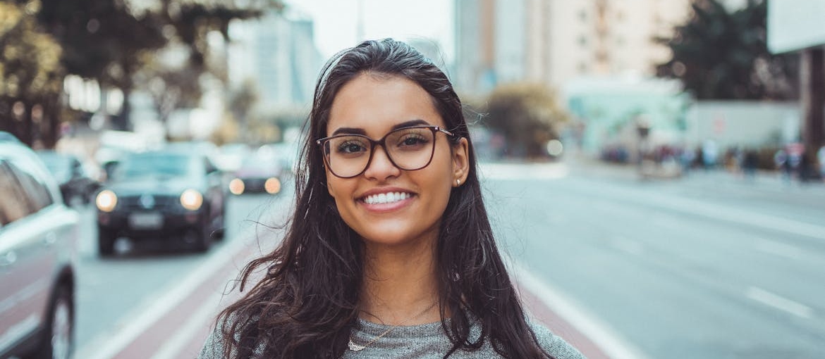 Woman smiling while looking at the camera.