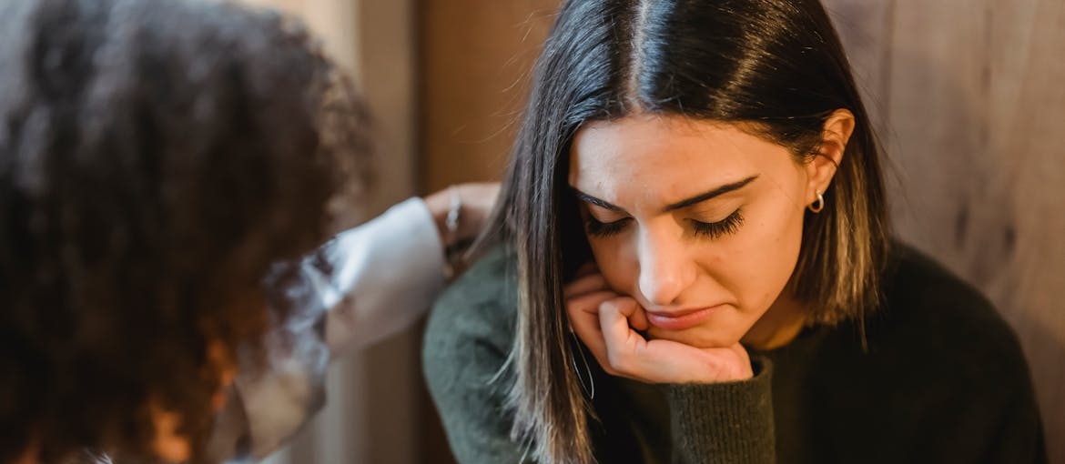 Woman supporting her friend who is struggling with relapse.