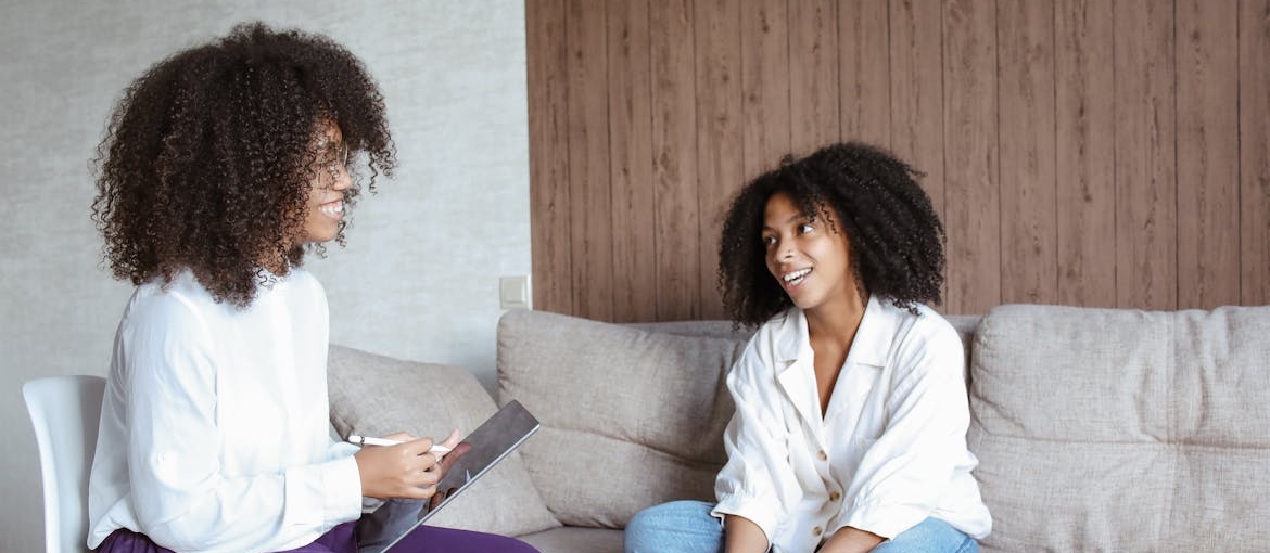 Woman and her therapist talking about how to develop self esteem.