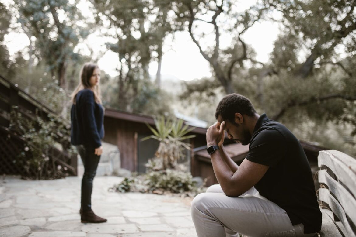 Man sitting on the bench after having an argument with his girlfriend.
