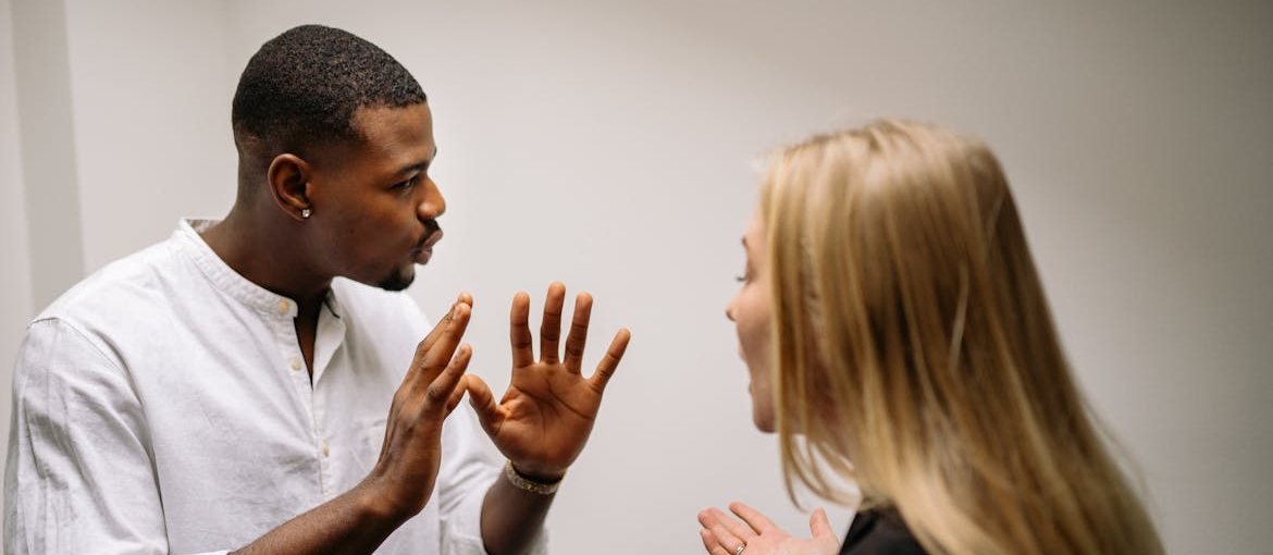 Couple having a fight about the signs of a drinking problem.