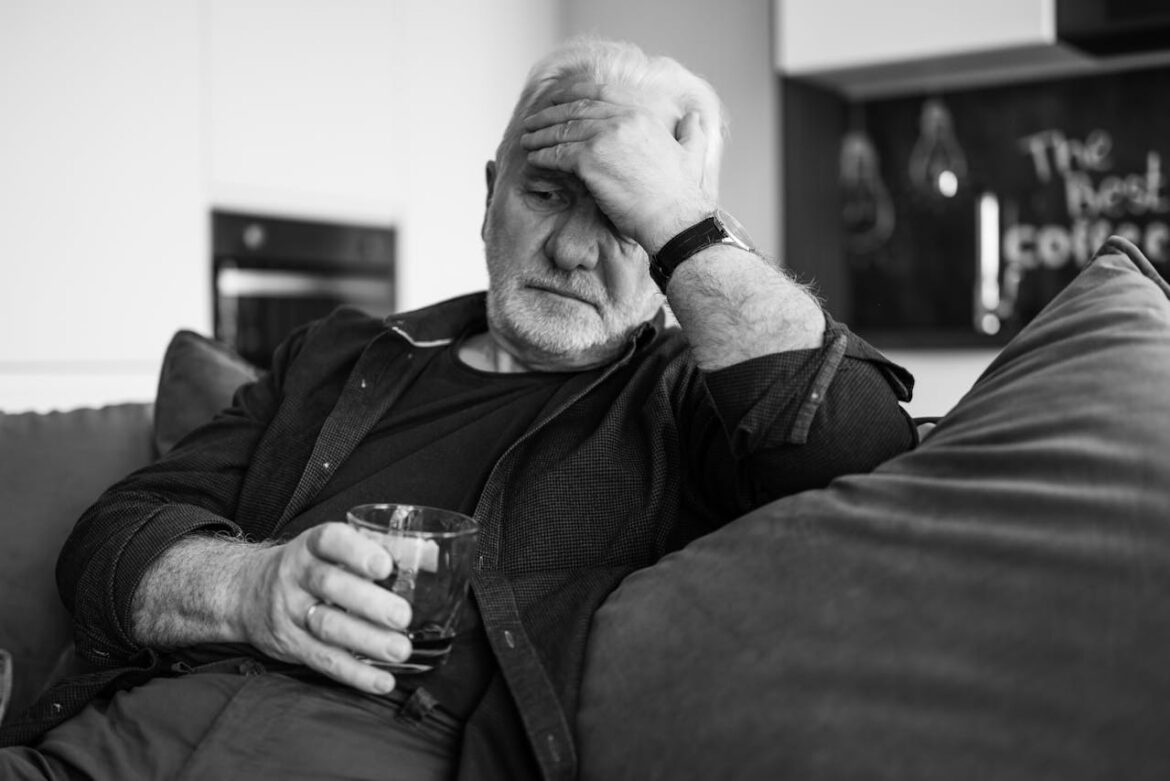 Man drinking wine and experiencing depression in the elderly.