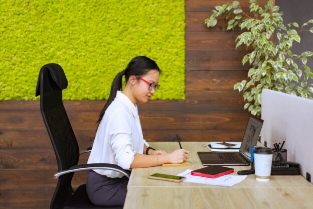 Woman in an office job balancing work and outpatient rehab.